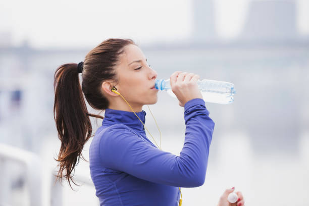 istock Sportswoman hydrating 872828580