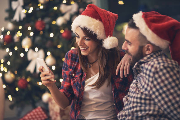 istock Young pair in love looking at cell phone together 872829082