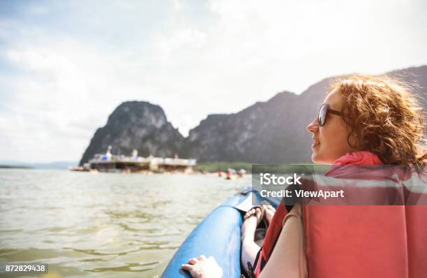 Young Woman Traveler With Life Jacket At Sunset Ride On Kayak Island Hopping Wanderlust Travel Concept With Adventure Girl Tourist Wanderer On Excursion In Thailand Warm Vintage Sunshine Filter Stock Photo - Download Image Now