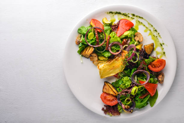 istock Brie cheese with grilled vegetables. Top view. Free space for text. On a wooden background. 872829684