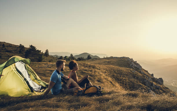 istock Young Couple Camping on Top of Hill 872832288
