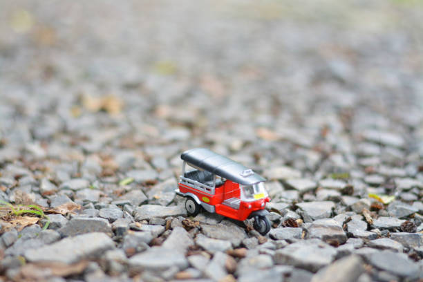 istock Red tuk tuk with stone background. 872839894