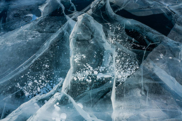 istock cracks of frozen water 872841264