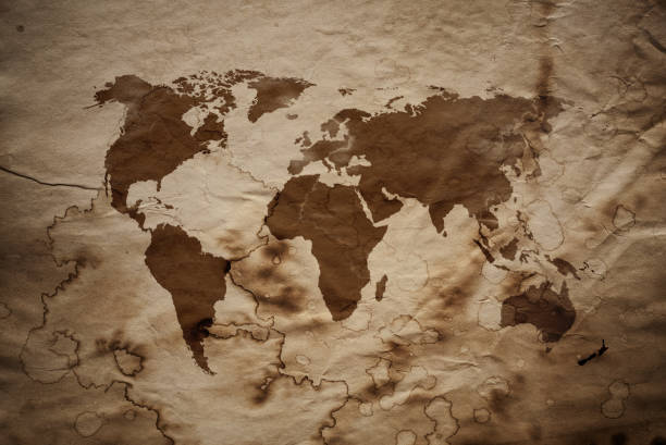 istock World Map on aged damaged paper 872844164