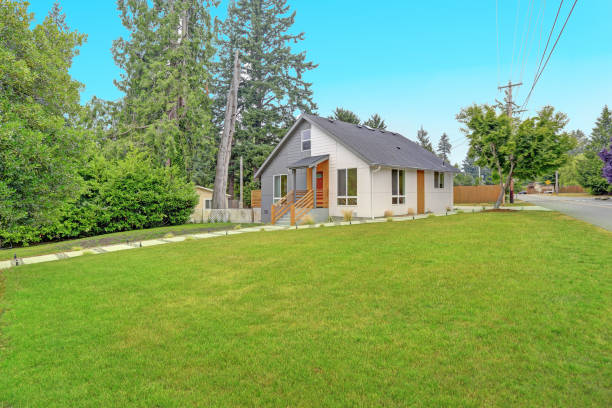istock Nicely renovated grey and white home exterior 872844694