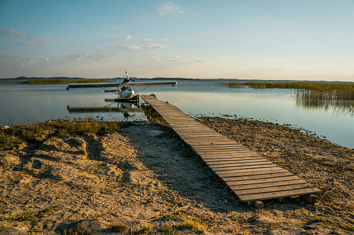 floatplane at wooden pier on beautiful lake