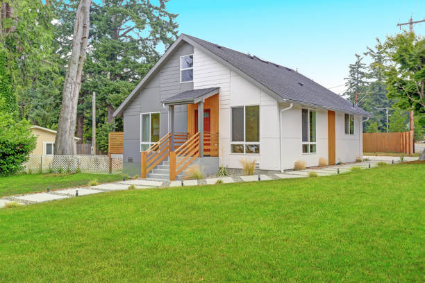 istock Nicely renovated grey and white home exterior 872844812