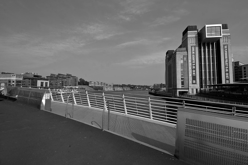 Gateshead, United Kingdom Visitors the Millenium bridge from Gateshead towards Newcastle.  This image shows the bridge with the Baltic in the background.