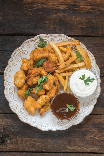 istock Chicken nuggets and french fries 872848470