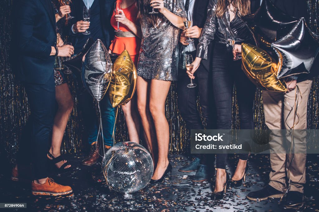 Party night Gruoup of friends celebrating New Year's eve. Party - Social Event Stock Photo