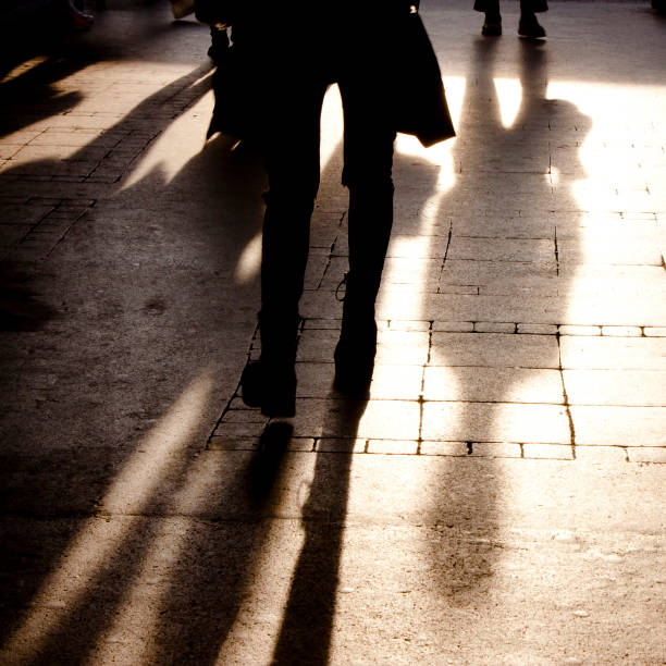istock Shadow and silhouette of people on the sidewalk 872849790