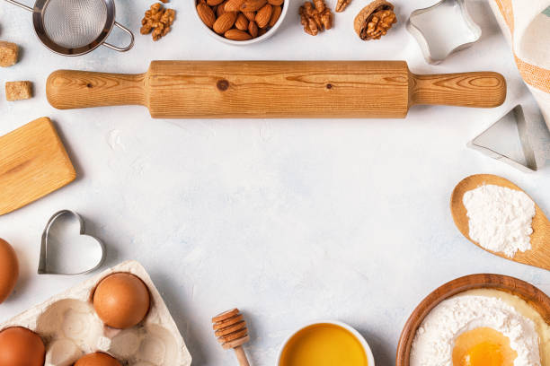 istock Ingredients for baking  - flour, wooden spoon, rolling pin, eggs. 872849996
