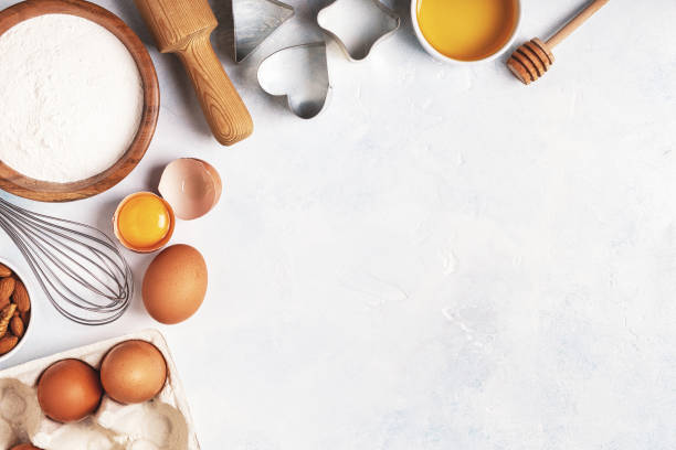 istock Ingredients for baking  - flour, wooden spoon, rolling pin, eggs. 872850002