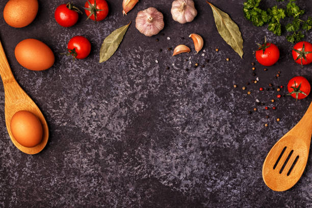 istock Ingredients for cooking on dark concrete background. 872850020