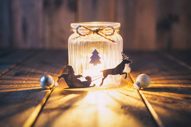 christmas decoration on old wood - candle jar card - reindeer christmas decoration gold photography imagens e fotografias de stock