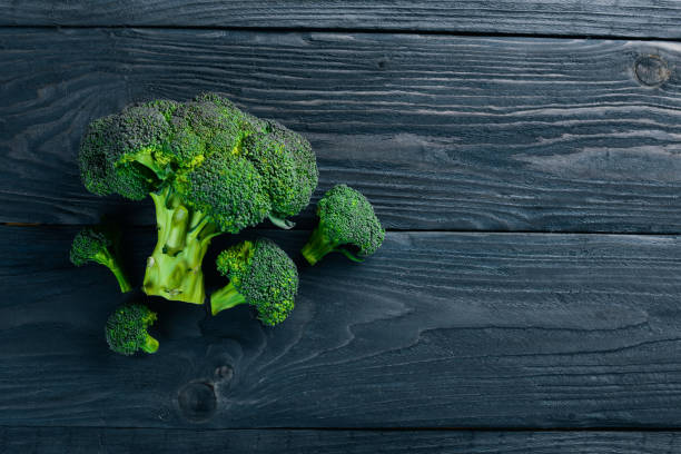 istock Broccoli. On a wooden background. Top view. Free space for your text. 872859376