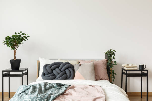 istock Simple bright bedroom with plant 872859386