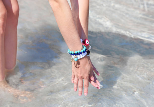 istock greek jewelry advertisement on the beach 872859428