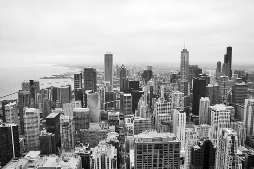 Chicago skyline aerial view. An overhead view of the city of Chicago downtown taken from the John Hancock Center skyscraper. Horizontal composition in black and white.