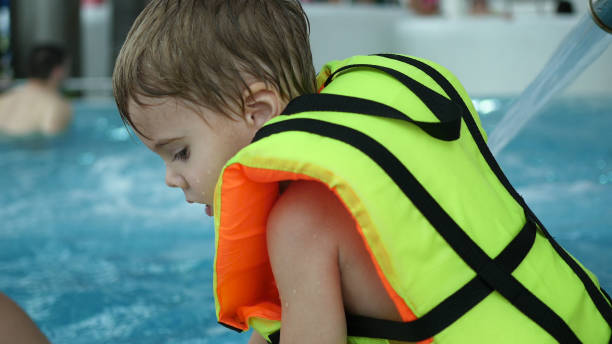 istock A boy swims in the pool. Relaxation and fun in the pool 872869030
