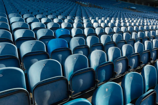 istock blue plastic seats in a stadium in symmetrical rows 872870222