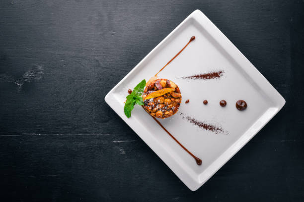 istock Nut Milk Chocolate Dessert. Top view. Free space for text. On a wooden background. 872874384