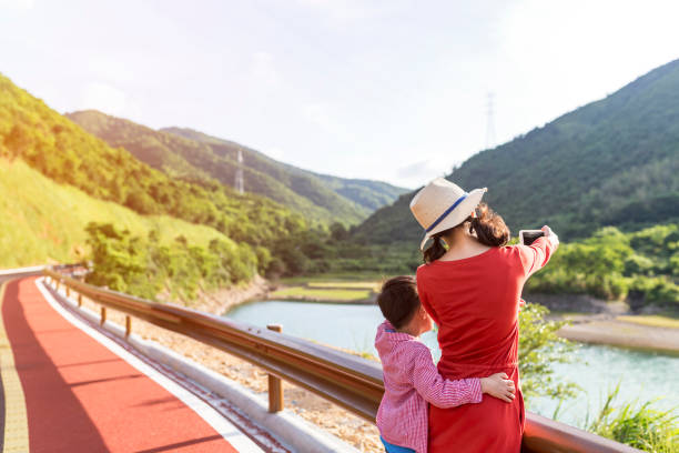 istock The mother guided her son to the view 872878120