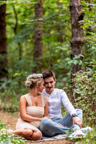 istock Happy newlyweds standing in the park 872881106
