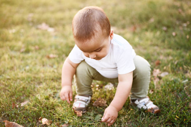 istock Happy baby boy in nature 872884564