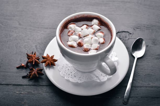 istock Cappuccino with marshmallow. On a wooden background. Top view. Free space for your text. 872884684