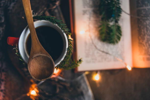 istock Cup of coffee with Christmas lights 872892690