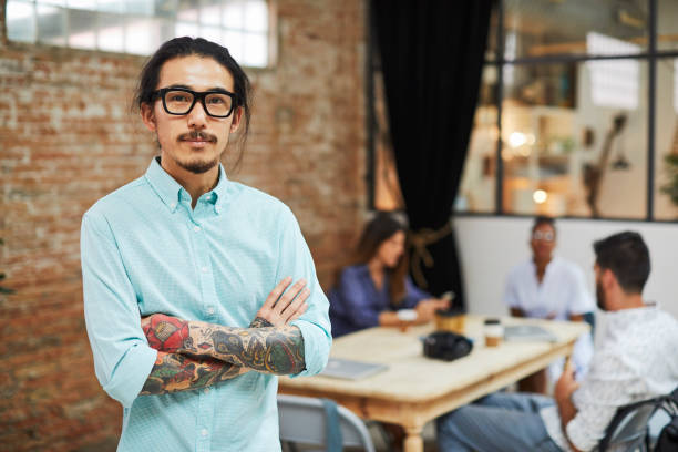 istock Business person looking at camera in startup office. 872896352