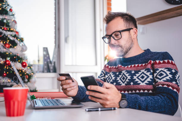 istock Men shopping online during christmas 872899870