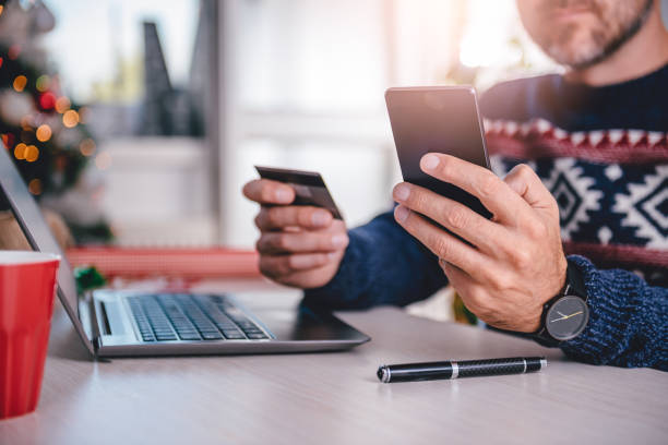 istock Men shopping online during christmas 872899920