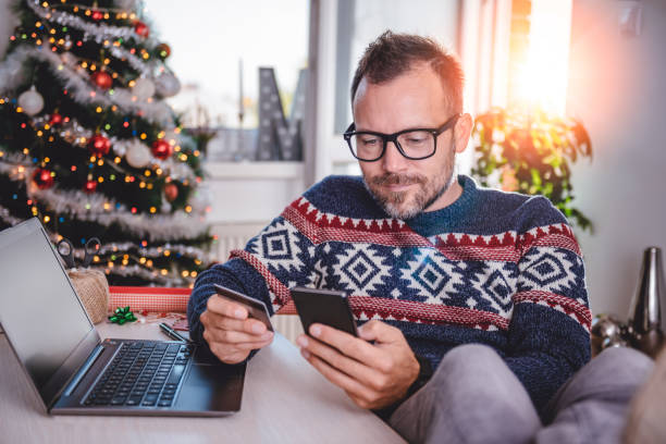 istock Men shopping online during christmas 872900280