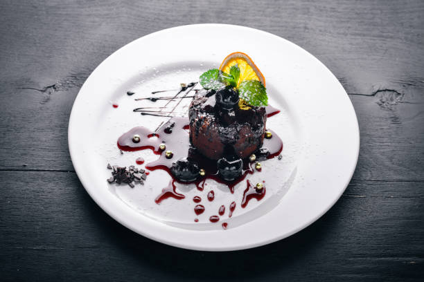 istock Chocolate dessert. Baking with ice cream. Top view. Free space for text. On a wooden background. 872902840
