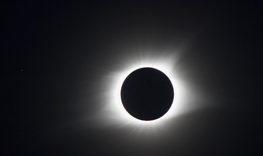 The moon blocks the sun but the sun's corona goes around the moon during a total solar eclipse's transit across the United States,  August 21, 2017 in Hopkinsville, Kentucky. The last solar eclipse seen in the United States was in 1979, but there will be another total eclipse crossing the United States in 2024. The eclipse was seen in 14 states.