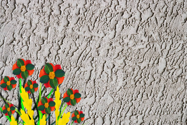istock Pattern of autumn leaves of different colors on a grey cement background 872916308
