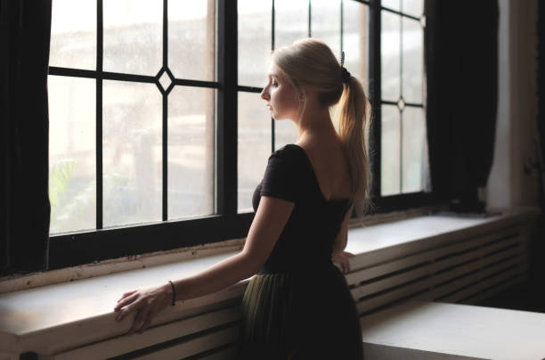 istock Ballerina near window 872928024