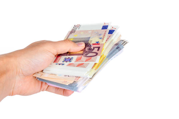 istock Euro Banknotes on Man Hand Saving Money 872931040