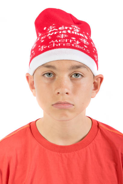 adolescent triste coiffé d’un chapeau de noël - 12 15 months photos et images de collection