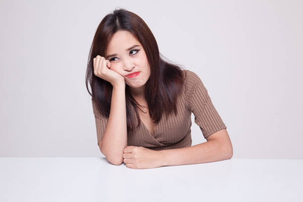 istock Asian girl is getting bore. 872937514