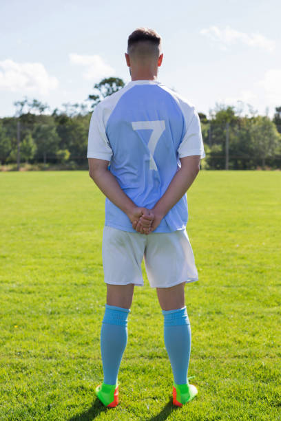 istock Football player standing in the ground 872938216