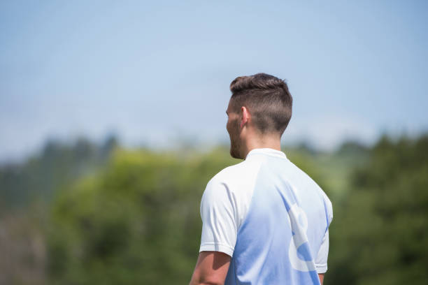 istock Football player standing in the ground 872942736