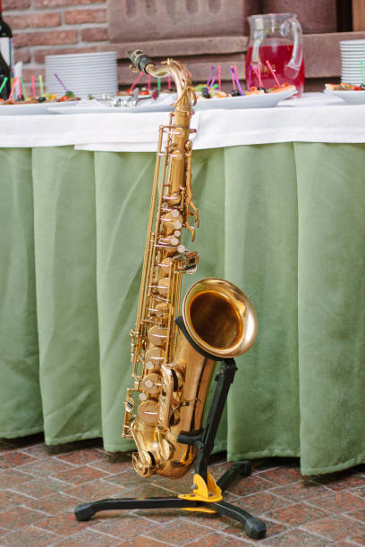 istock Golden saxophone staying on the rack 872950314