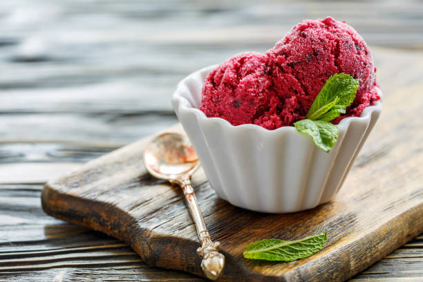 istock Bowl of ice cream of black currant. 872950428