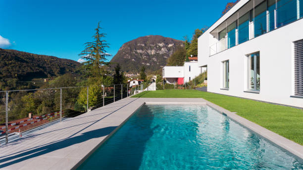 istock Luxury house with garden and swimming pool 872953208
