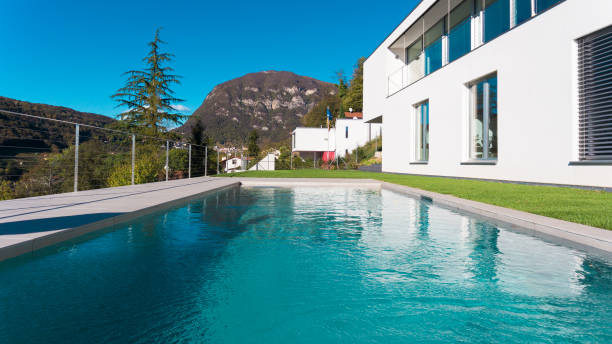 istock Luxury house with garden and swimming pool 872953944