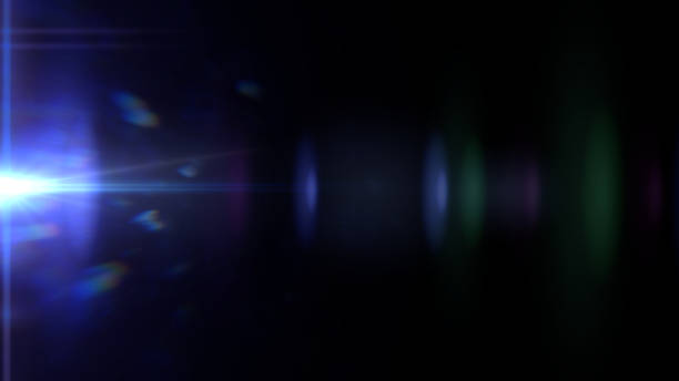 istock beautiful blue lens flare effect overlay texture with light streak and bokeh effect in front of a black background 872957774