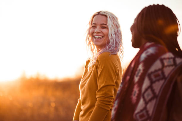 Ecstatic Young Girls Walking In Nature On Sunny Autumn Day